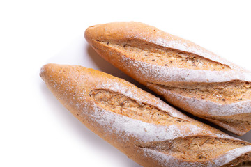 Fresh Homemade Sliced French Baguette Bread isolated on white background