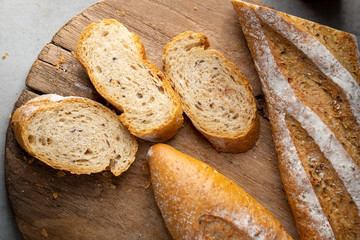 Fresh Homemade Sliced French Baguette Bread On Wooden Bread Board