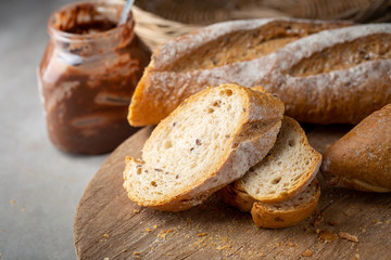 Fresh Homemade Sliced French Baguette Bread On Wooden Bread Board