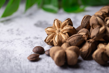 Fototapeta na wymiar A pile of dried Sacha Inchi nuts. Natural background in lighting studio