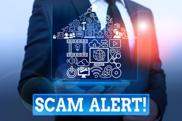 Writing note showing Scam Alert. Business concept for fraudulently obtain money from victim by...