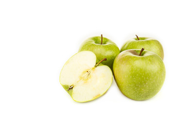 green ripe fresh apples with one half isolated on white