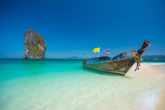 Beautiful beaches and longtail boat at Pucket, Thailand