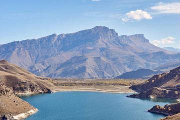 a huge mountain range and a lake in the mountains    