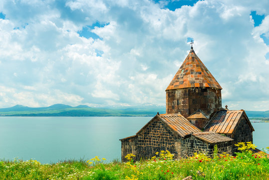 View of Sevanavank Monastery and Lake Sevan, a landmark of Armenia on a sunny afternoon