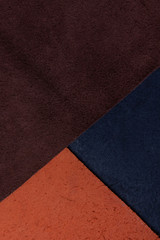 abstract leather background, in triangles, different colors. copy space