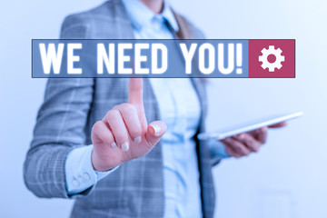 Conceptual hand writing showing We Need You. Concept meaning asking someone to work together for certain job or target Business concept with mobile phone and business woman