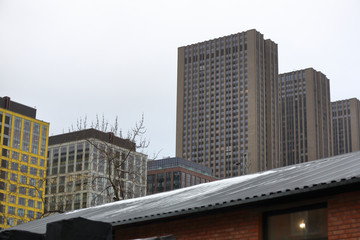 High-rise building with offices in an industrial area on a cloudy day
