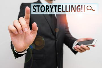 Writing note showing Storytelling. Business concept for activity writing stories for publishing them to public Male human wear formal work suit hold smartphone using hand