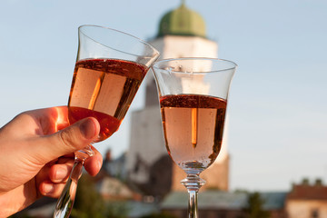 two full glass of wine on the background of the sky and the castle.