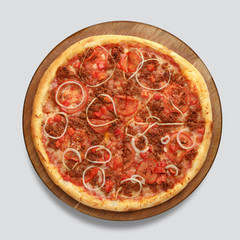 Appetizing pizza on a wooden board isolated on a gray background. Top view.