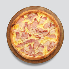 Appetizing pizza on a wooden board isolated on a gray background. Top view.