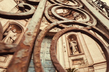 Fototapeta na wymiar Facade of the 18th century Catania Cathedral of Saint Agatha, designed in Baroque style with sculptures. Catania, Sicily.