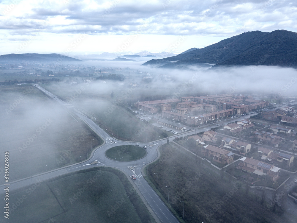 Canvas Prints aerial view street in the fog, tuscany