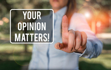 Handwriting text writing Your Opinion Matters. Conceptual photo show you do not agree with something that just been said Woman in a blue business shirts pointing with her finger into empty space