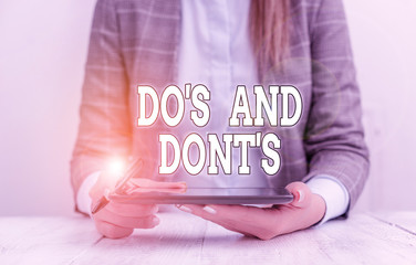 Conceptual hand writing showing Do S And Dont S. Concept meaning Rules or customs concerning some...