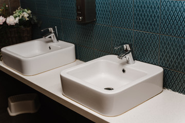 Toilet sink interior of public toilet with of washing hands. Close up