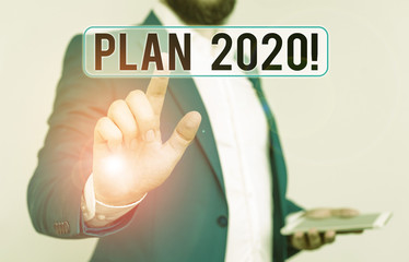 Conceptual hand writing showing Plan 2020. Concept meaning detailed proposal doing achieving...