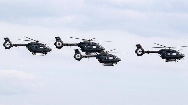 BERLIN - APR 27, 2018: Formation of the new German Air Force Airbus H145M helicopters in flight during the Berlin ILA Air Show.