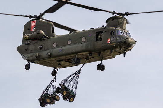 BERLIN - APR 27, 2018: British Royal Air Force Boeing CH-47 Chinook transport helicopter slingload demonstration at the Berlin ILA Air Show.