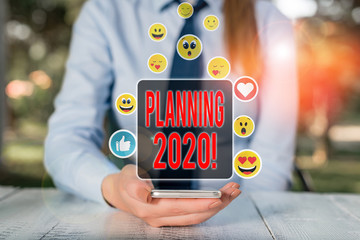 Conceptual hand writing showing Planning 2020. Concept meaning process of making plans for...