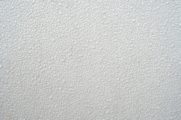 Fototapeta na wymiar White metal surface background with water drops.