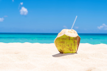 Fresh Coconut on white Caribbean Beach - obrazy, fototapety, plakaty
