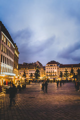 Christmas market in Leipzig at nigh. Street with lights and dramatic sky in winter time in Leipzig .Christmas time in Leipzig. Travel and tourism in Leipzig .