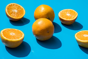 oranges and lemons on a light blue background