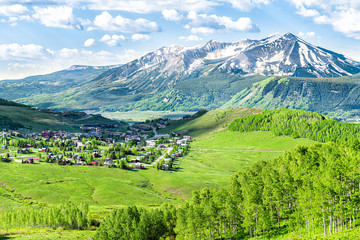 Crested Butte, Colorado town cityscape high angle view from Snodgrass hiking trail in summer with...
