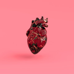 Realistic human heart organ with arteries and aorta 3d rendering. Happy Valentines Day greeting card. Romantic background. Red and golden marble glass heart