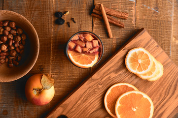 Served mulled wine and nuts table, top view.