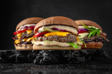 Delicious juicy burgers from Brioche Bun, fresh vegetables, delicious meat and seafood. Hamburger...