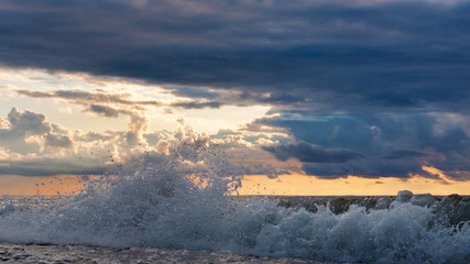 The wave against sunset sky