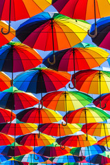 Fototapeta na wymiar Colorful bright umbrella street decoration passage
