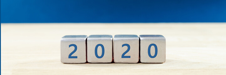 2020 written on silver glitter  blocks in a conceptual image of the coming new year.