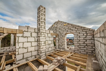 Building site of a house under construction made from white foam concrete blocks.