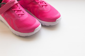 modern pinky sport shoes .Pair of sport shoes on colorful background. New sneakers on soft green background, copy space. running shoes.Pink sneakers.Pair of pink training shoes for girls.ladies women
