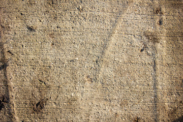 Wet concrete texture under the sun