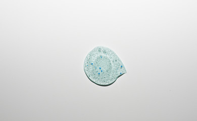 Smear  of blue scrub isolated on white. Beauty texture.  