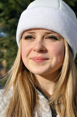 portrait of happy teenage girl dressed as Snow Maiden