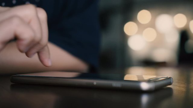 4k video People hand using smartphone with blur cafe shop background. Business, financial, trade stock maket and social network concept.