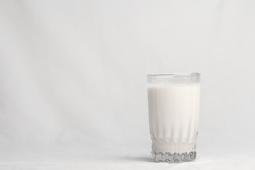 a glass of milk on white background