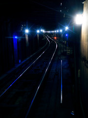 Dark Urban Metro Train Rail Tracks Underground At Night With Lights