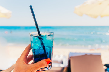 blue cocktail at the beach