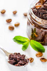 Spa concept with natural coffee scrub on wooden table background