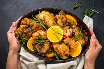 Baked chicken with orange, cranberry and rosemary.