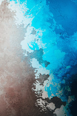 Wall with decorative plaster resembling picture of the sea. Abstract background.