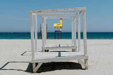 Lounge chair and lifeguard chair on the beach