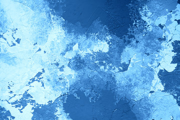 Wall with decorative plaster resembling picture of the sea. Abstract background.